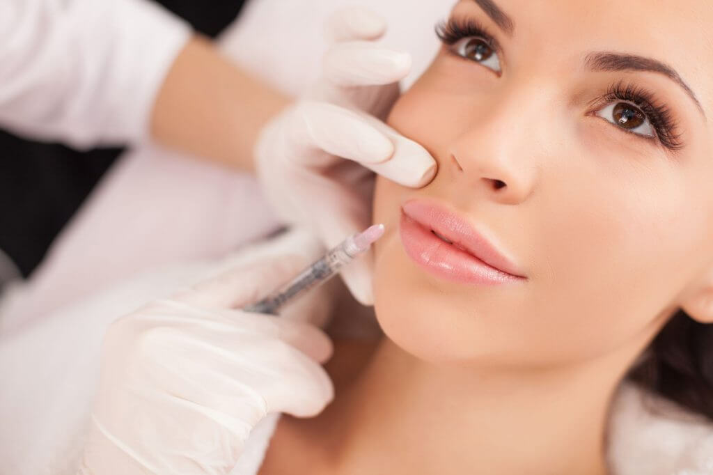 Dermal filler being given to woman's lips