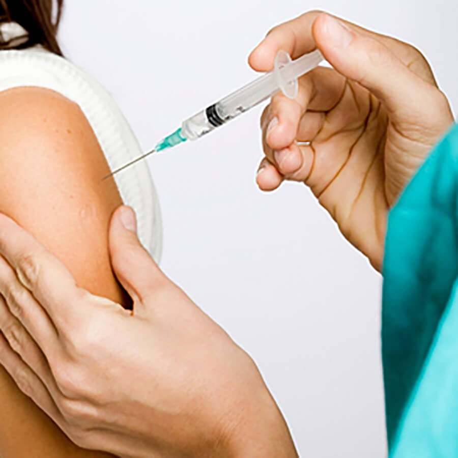 Woman receiving a vitamin B12 injection in her arm