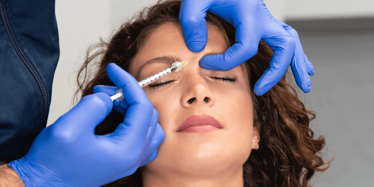woman receiving botox injections in forehead