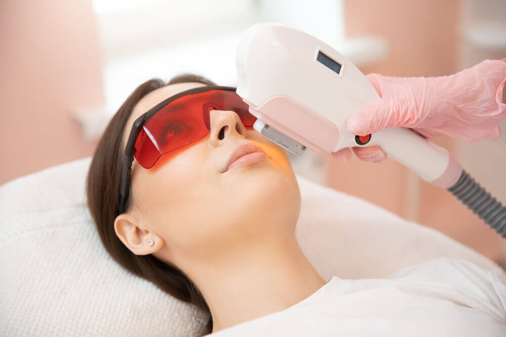 Woman gets laser treatment on face