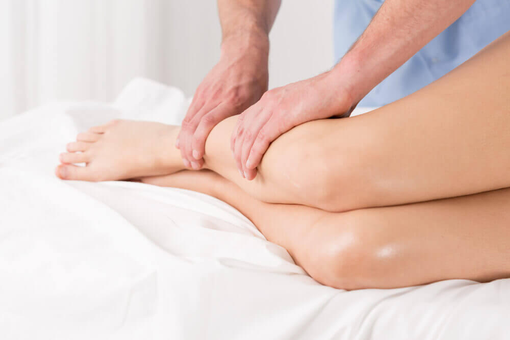 A massage therapist performing a lymphatic drainage massage